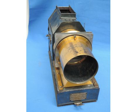 A Victorian Magic Lantern, The Praestantia, Rilley Bros, Bradford, having plague and engraved decoration with a collection of