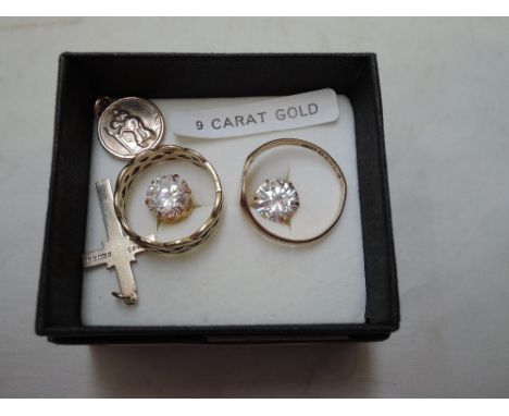 A small selection of 9ct gold jewellery including a plaited band ring, signet ring, cubic zirconia stud earrings and two pend