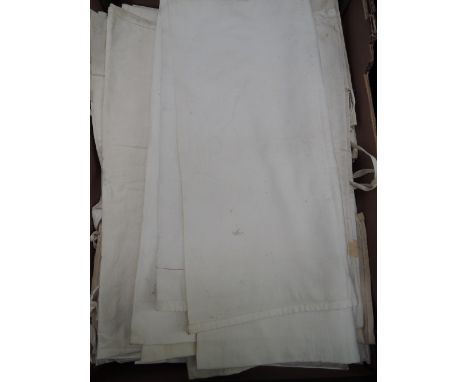 A box of Edwardian bed linen including a large selection of pillowcases and one loose sheet 
