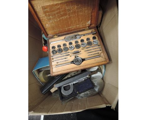 A selection of vintage tools and spares etc including tap and die set, 1930's needles, clockwork and music box parts