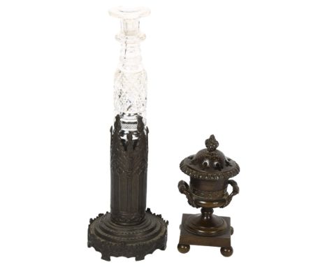 A long Victorian cut-glass perfume bottle in original patinated bronze stand, height 27cm, and a Victorian patinated bronze u