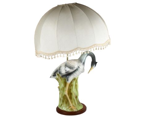 A large Majolica table lamp and shade in the form of a heron amongst the reeds, on a turned wood base, heron height 59cm, hei