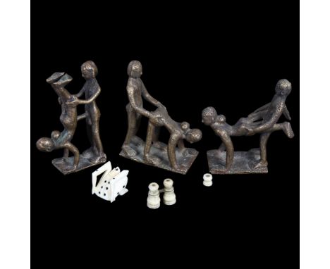 A miniature Stanhope binoculars, and 1 other, made of bone, a bone die, and 3 erotic bronze figurines (6) 