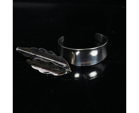 ULRICH - a modernist Danish sterling silver torque bangle, and a sterling silver leaf design brooch by the same maker (2) 