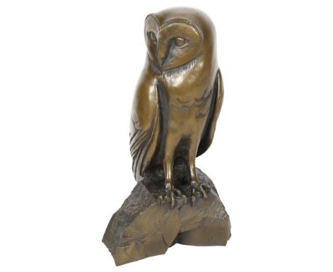 A resin bronze study of an owl on a rock, impressed M to the reverse, H28cm 