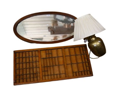 A printer's tray, an early 20th century inlaid satin oval bevel-edge wall mirror, 84cm x 46cm, and a brass hammered design ta