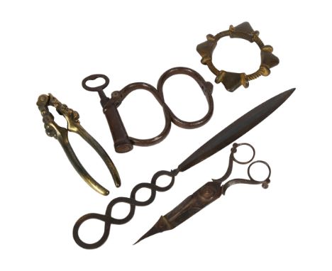 A 19th century Hiatt Irish 8 handcuffs, with Hiatt impressed on the key and cuffs, an Antique bronze slave bangle, candle snu