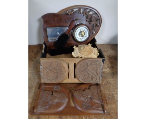 A box containing antique and later wooden pieces to include book slides, wooden trivet, mirrored barometer brush set etc 