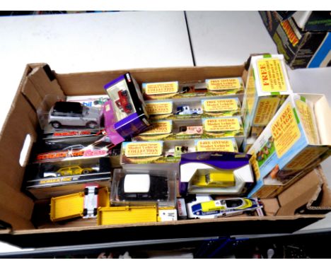 A box containing assorted boxed die cast vehicles to include delivery vans, Ringtons vehicles, Corgi Cadbury's, together with