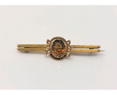 An antique gold citrine and pearl bar brooch CONDITION REPORT: Apparently unmarked. 2.8g