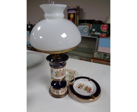 An Italian ceramic lamp with glass shade and matching ash tray  