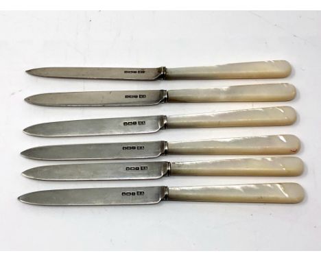 Six silver bladed table knifes with mother of pearl handles