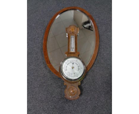 An Edwardian dressing table mirror together with an Edwardian oak barometer  