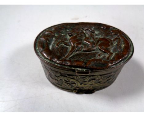 An antique embossed plated snuff box depicting figure on horseback   