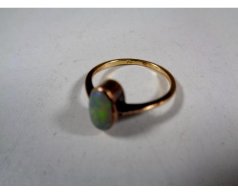 A gold opal ring (hallmarks rubbed) 