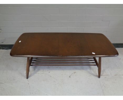 An Ercol solid elm and beech coffee table with under shelf in an antique finish  