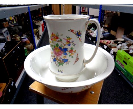 An antique floral transfer printed wash jug and basin 