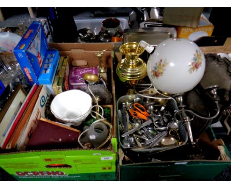 Two boxes of miscellany to include games, cutlery, plated trays, candelabra, brass table lamp with globe shade 