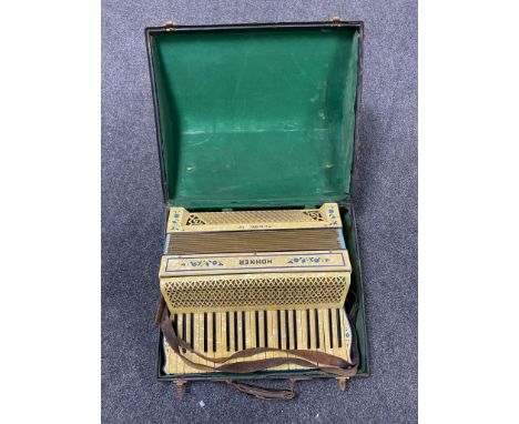 A Hohner Tango IV piano accordion in case