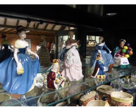 Six Royal Doulton figures and another by Coalport