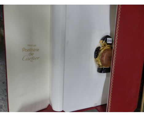 A large cased panthere  de Cartier scent bottle in red and gilt case with integral backgammon board.