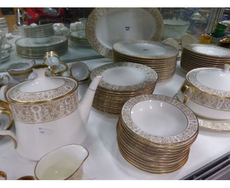 An extensive gilt decorated Noritake dinner service to include various serving dishes, plates of different size,etc together 
