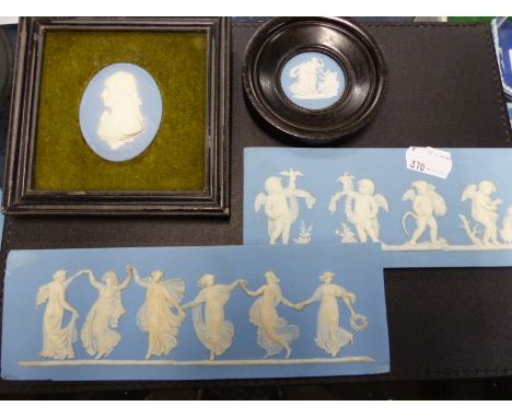 Two antique blue Wedgwood Jasper ware plaques of classical figures, an oval profile bust of Nelson and a small circular plaqu