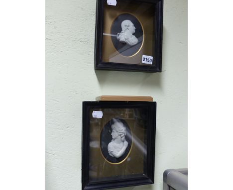 A pair of Wedgwood oval black Jasper ware portrait plaques of David Garrick and Sarah Siddons. framed.  12cm high