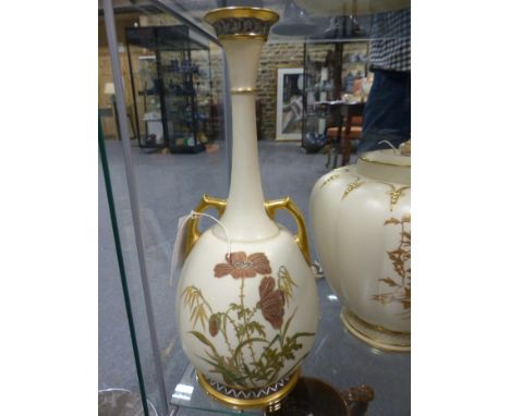 Royal Worcester Eastern inspired bottle form twin handle vase with raised floral and gilt decoration. 38cm high.