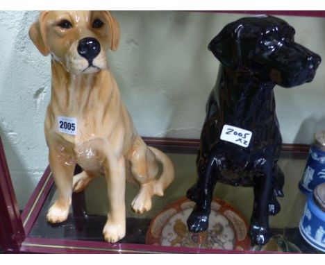 Two Beswick pottery figures of retrievers one gold one black. 33cm high