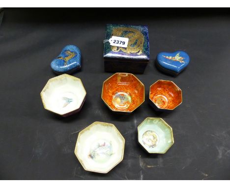 Daisy Makeig-Jones: A Wedgwood dragon lustre saucer shaped cigarette box. Pattern number 24831. 10.5cm. Two heart shaped trin