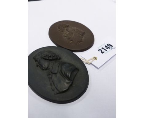 Two Basalt oval portrait plaques. One of Josiah Wedgwood. 9.5cm high, the other of Admiral Nelson. 9cm high
