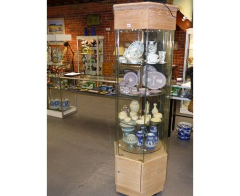 A Royal Worcester four tier display cabinet of hexagonal form with oak pediment and base. 196cm high