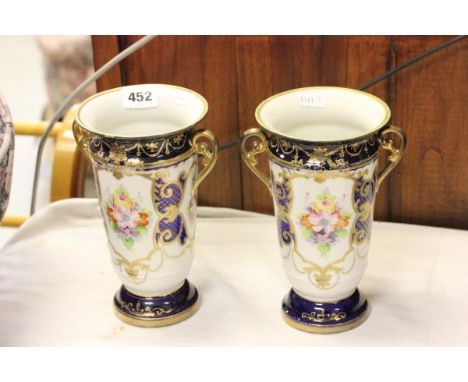 Pair of Noritake Vases, blue and gilt with floral panels