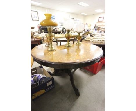 Large 19th century Mahogany Circular Table, the top with floral Marquetry inlay raised on a heavily carved pedestal base