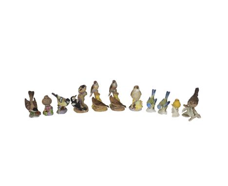 Royal Worcester - six porcelain bird figurines to include: Nightingale (a/f); Pied Woodpeckers; American Robin; Thrush; 2 x L