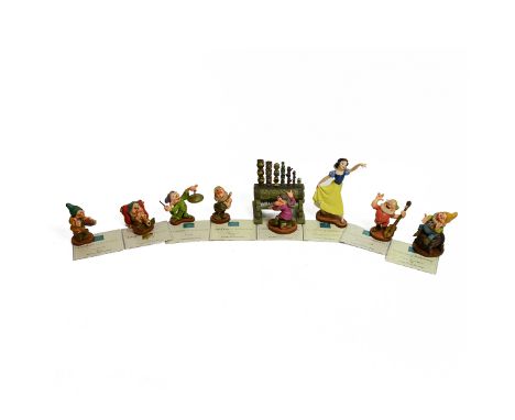 Walt Disney's Snow White and the Seven Dwarfs, collection of porcelain figurines to include Snow White, Dopey, Sleepy, Happy,