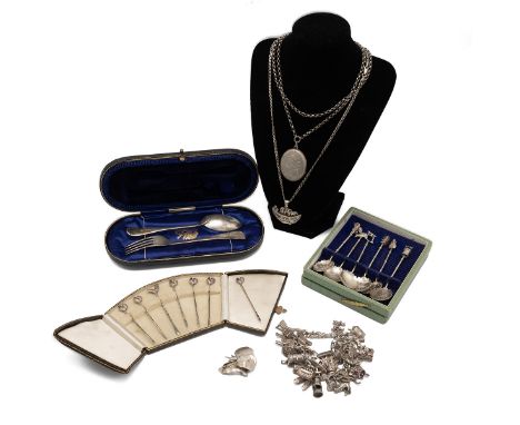 A silver christening set, along with a set of silver cocktail sticks each with a cockerel finial, silver charm bracelet, silv