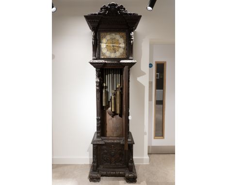 A monumental long case clock. The mechanism by Maple &amp; Co of London, with a three train, eight day movement, chiming the 