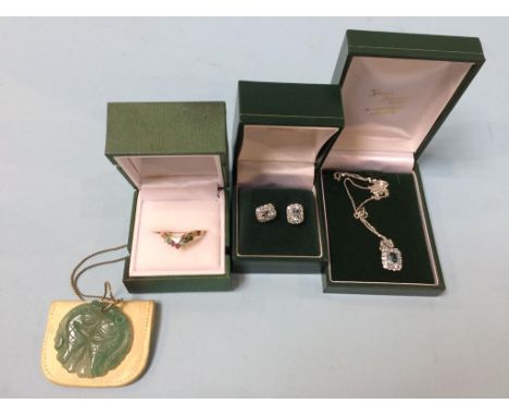 A pair of 9ct white gold earrings and necklace, and a jade pendant etc.
