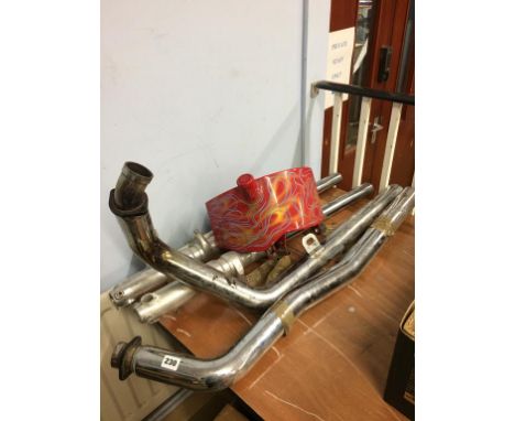 Harley Davidson exhaust pipes, forks and oil tank