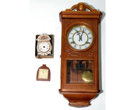 A CARVED OAK WALL CLOCK WITH ENAMEL DIAL, 53CM H, EARLY 20TH CENTURY AND TWO SMALL TIMEPIECES