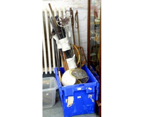 VINTAGE SPORTING EQUIPMENT COMPRISING A PAIR OF SKI POLES, TENNIS RACQUETS, GOLF CLUBS, HOCKEY STICKS, HELMETS, ETC