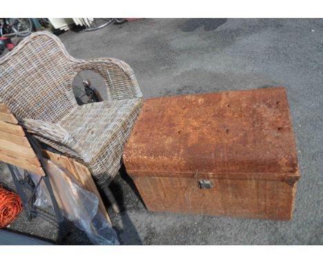 An old tin trunk - sold with a wicker chair