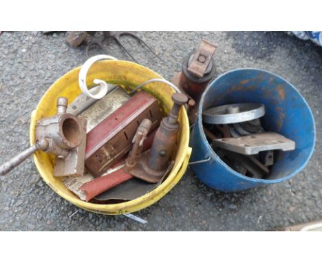 Two buckets containing a quantity of assorted tools including old bottle jacks, etc.