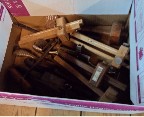 A box containing assorted joinery tools including marking gauges, drawer knives, etc.