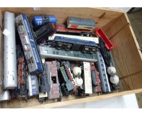 A wooden crate containing a quantity of model trains including Lima Italy locomotive and carriages, Rivarossi, etc.