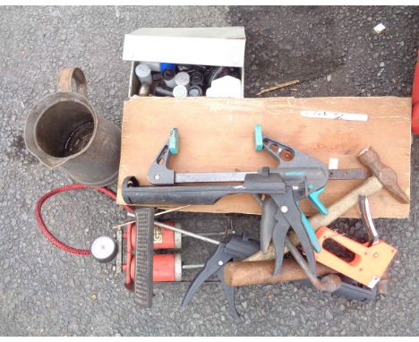 A quantity of assorted tools including foot pump, caulking guns, etc.