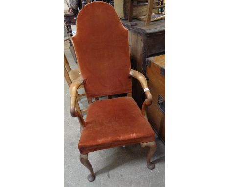 An early 20th Century Queen Anne style high panel back elbow chair with russet velour upholstery, set on cabriole front legs 