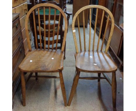 Three old matching hoop stick back kitchen chairs with moulded solid elm seats, set on tapered supports